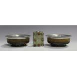 A pair of Tibetan white metal mounted burlwood bowls, late 19th/early 20th century, each underside