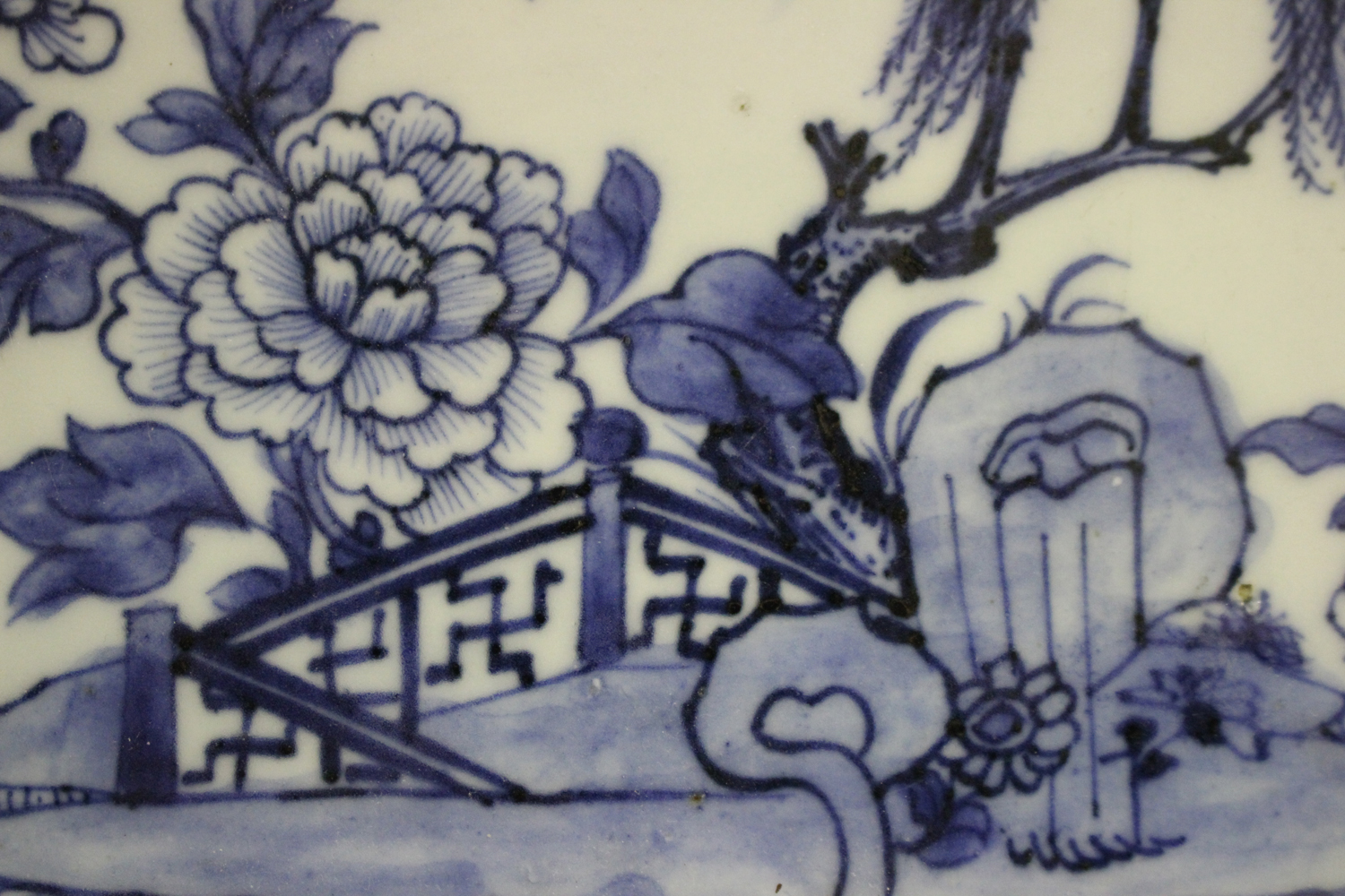 A Chinese blue and white export porcelain meat dish, Qianlong period, painted with a fenced garden - Image 2 of 3