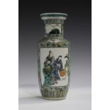 A Chinese famille verte porcelain rouleau vase, Kangxi style but late 19th century, painted with