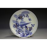 A Chinese underglaze blue and red porcelain circular dish, mark of Kangxi but later, painted with