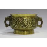 A Chinese polished bronze censer, late Qing dynasty, the bombé circular body cast with six character