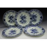 A set of five Chinese blue and white export porcelain plates, 18th century, painted with a central