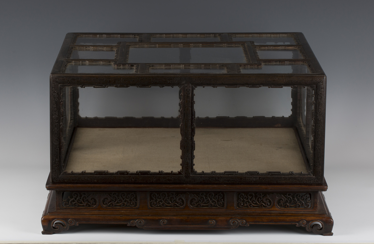 A Chinese silver wire inlaid hardwood and glazed table top display case and stand, late Qing