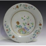 A Chinese famille rose export porcelain circular dish, Qianlong period, the centre painted with a