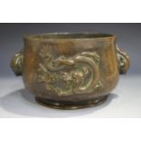 A Chinese brown patinated bronze bombé censer, the body cast in relief with opposing dragons,