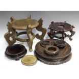 A collection of fourteen Chinese circular wood stands, late Qing dynasty and 20th century, of