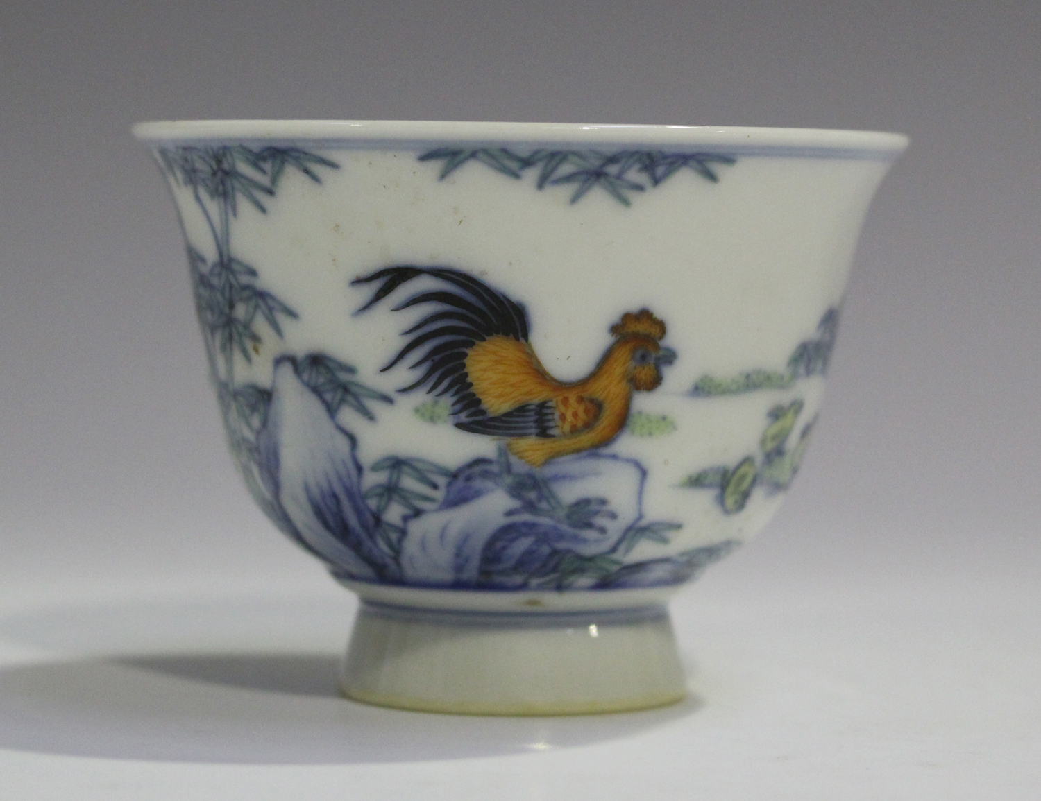 A Chinese doucai porcelain footed cup, mark of Yongzheng but modern, the exterior painted with a