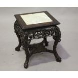 A Chinese hardwood stand, late 19th/early 20th century, the square top inset with a marble panel