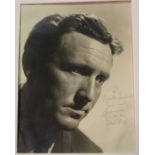 AUTOGRAPH. A black and white photograph of Spencer Tracy, signed, dedicated and dated 'Jan 1938' by