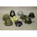 A late 20th century Nato M1 type helmet, a 1970s British Mk III turtle style helmet, a British Mk