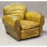 An Art Deco French brown leather club armchair of shaped deep-seated design, height 80cm, width