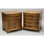 A pair of late 20th century reproduction yew bowfront bedside chests, fitted with leather inset