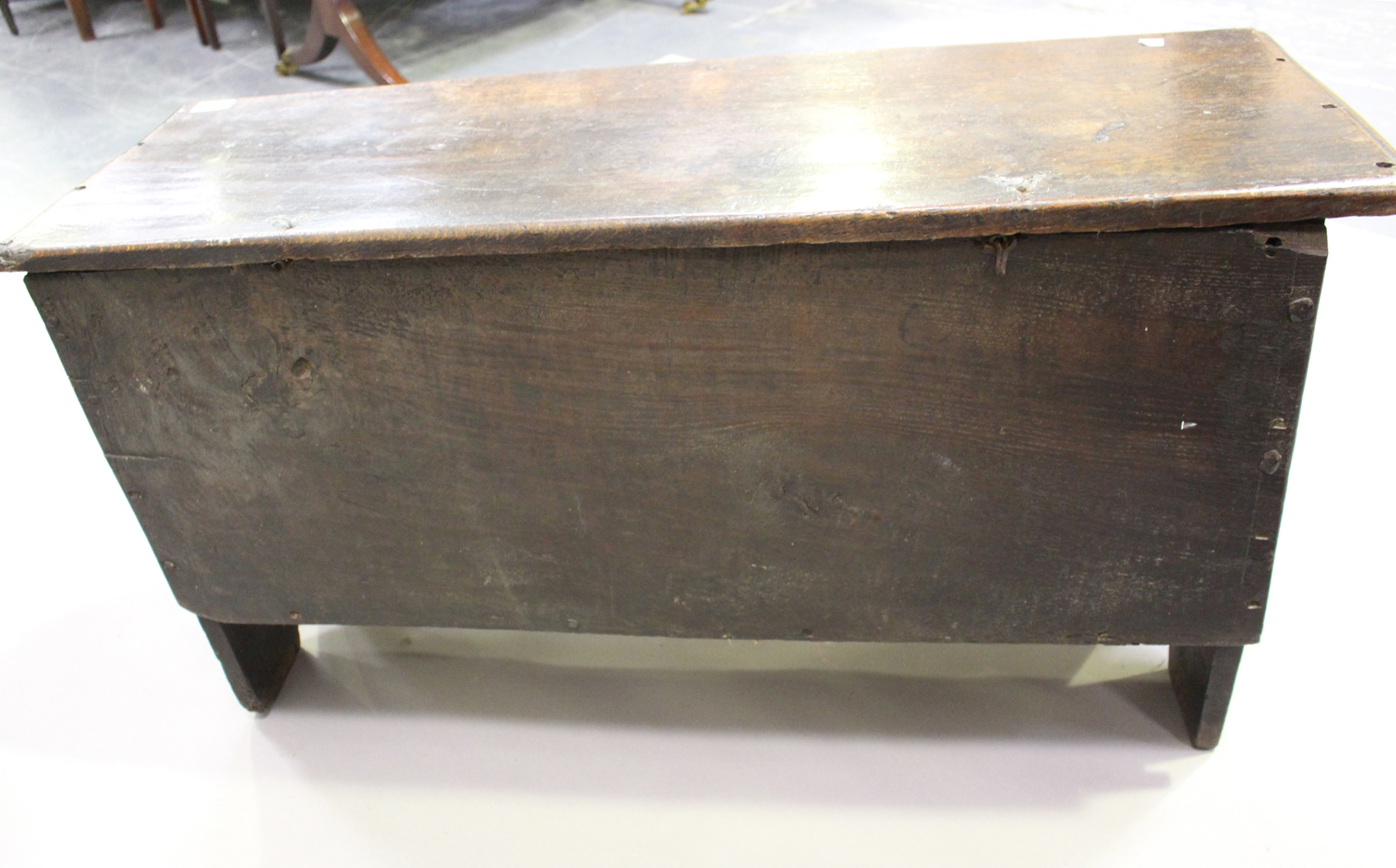 A late 17th century oak six plank boarded coffer, the front with later carved decoration, height - Image 2 of 4