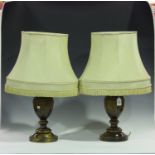 A pair of 20th century turned fruitwood table lamps of urn form, height 45cm, together with shades.