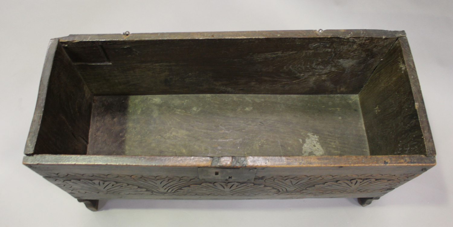 A late 17th century oak six plank boarded coffer, the front with later carved decoration, height - Image 3 of 4