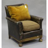 An Art Deco walnut framed armchair, upholstered in brown leatherette, height 74cm, width 67cm, depth