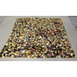 A late 19th/early 20th century patchwork quilt, worked with raised velvet flowerheads, 178cm x 170cm