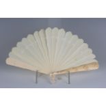 A mid-19th century Dieppe ivory brisé fan, the two guards finely carved with trailing flowers,