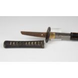 A Meiji period Japanese wakizashi, the slightly curved single-edged blade with distinct yakiba,