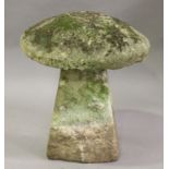 A 19th century carved staddle stone of typical mushroom form, height 67cm, diameter 57cm.Buyer’s