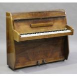 An Art Deco style walnut cased upright mini piano by Zender, overstrung, height 101cm, width 114cm.