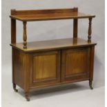 A late Victorian walnut buffet, fitted with a pair of panelled doors, raised on china castors,