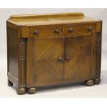 An Art Deco oak side cabinet, fitted with two drawers above cupboards, on bun feet, height 97cm,