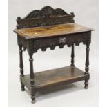 A late Victorian oak hall table with overall carved decoration, height 93cm, width 77cm, depth
