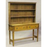 A 20th century Arts and Crafts style oak dresser, the shelf back above two drawers, height 176cm,