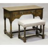 A modern 18th century style oak dressing table by Bylaw, height 76cm, width 106cm, depth 50cm,