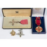 An M.B.E. civil issue with instructions as to wearing and Royal Mint case, two military badges,