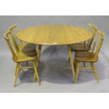 An Ercol pale elm drop-flap oval breakfast table, height 72cm, length 124cm, depth 113cm, together