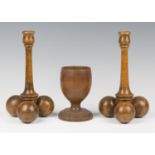 A pair of 20th century turned beech candlesticks with spherical tripod supports, height 25cm,