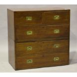 A late Victorian mahogany campaign chest with inset brass handles, fitted with two short and three