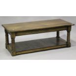 A late 20th century Jacobean style oak two-tier coffee table, height 45cm, length 123cm, depth