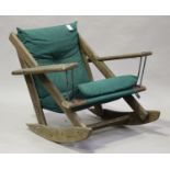A late 20th century Canadian stained softwood rocking armchair, fitted with loose cushions, height
