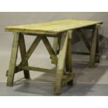 A large early/mid-20th century pine trestle table, the five-plank top on a pair of 'A' frame