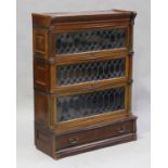 An early 20th century mahogany Globe Wernicke four-section bookcase with three leaded glass doors