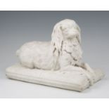 A 19th century Continental carved Carrara marble model of a King Charles spaniel lying on a