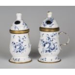 A pair of scarce mid-18th century South Staffordshire enamel mustard pots, finely painted with