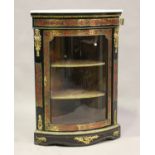 A mid/late 19th century ebonized boulle work corner display cabinet, the white marble top above a
