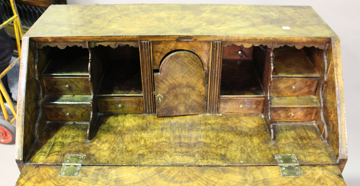 A George I walnut bureau with feather banded borders, the fall-flap enclosing a fitted interior, - Image 3 of 5