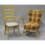 An Ercol spindle back armchair fitted with loose cushions, height 86cm, width 72cm, depth 63cm,