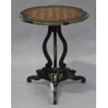 A mid-19th century ebonized and parquetry veneered tip-top wine table with a lobed circular top