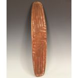 An Australian aboriginal carved hardwood wunda shield, the slightly curved front with overall