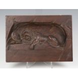 A late 19th century Continental walnut plaque, carved in heavy relief with the Lion of Lucerne,