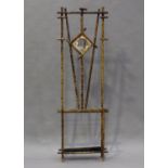 A late 19th/early 20th century bamboo framed hall stand, inset with a bevelled mirror, height 200cm,