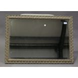 A late 20th century giltwood rectangular wall mirror with bevelled plate, 60cm x 85cm.Buyer’s