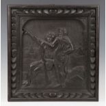 A 20th century Continental carved walnut wall panel, decorated in relief with two figures with