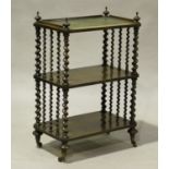 A mid-Victorian rosewood three-tier whatnot, the top inset with leather, raised on barley twist